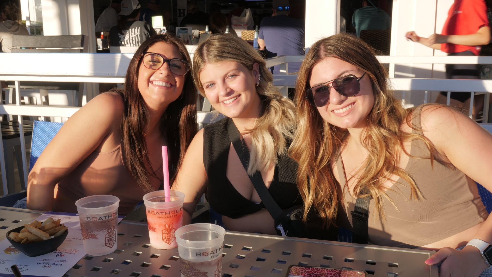 Three friends enjoying a sunny afternoon at Boathouse